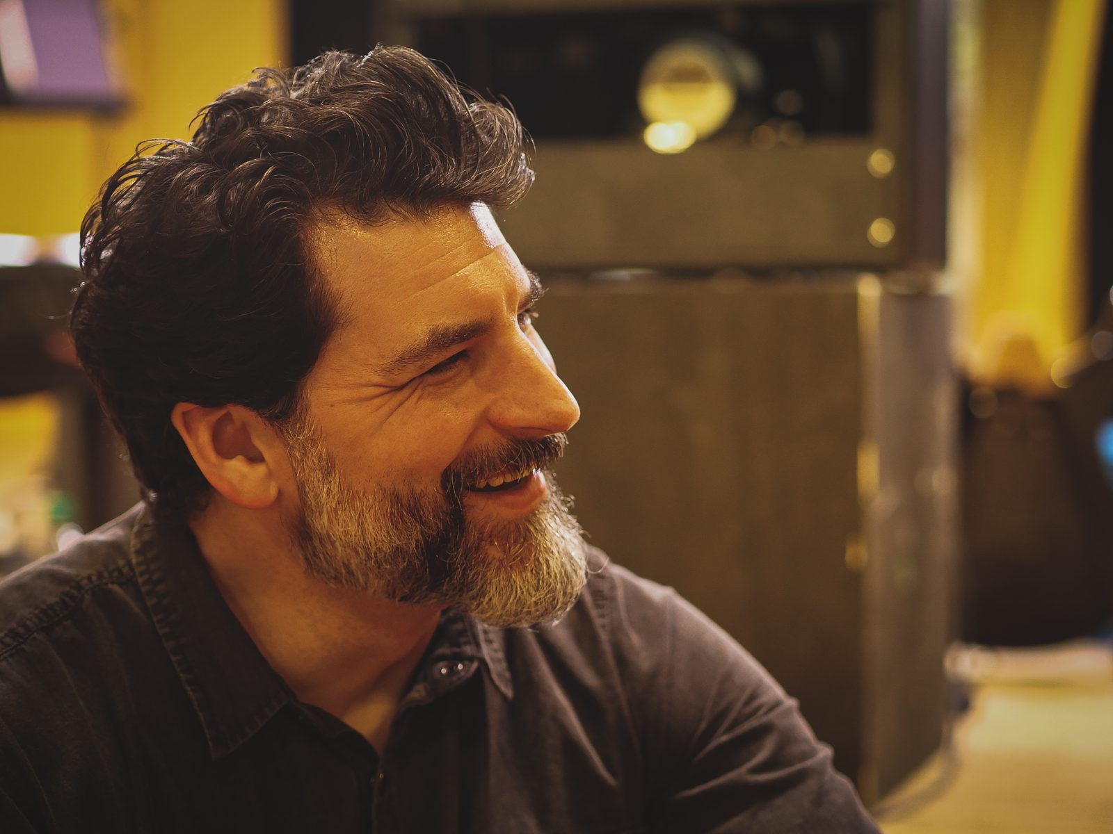 Matthew Cochran laughing, in profile